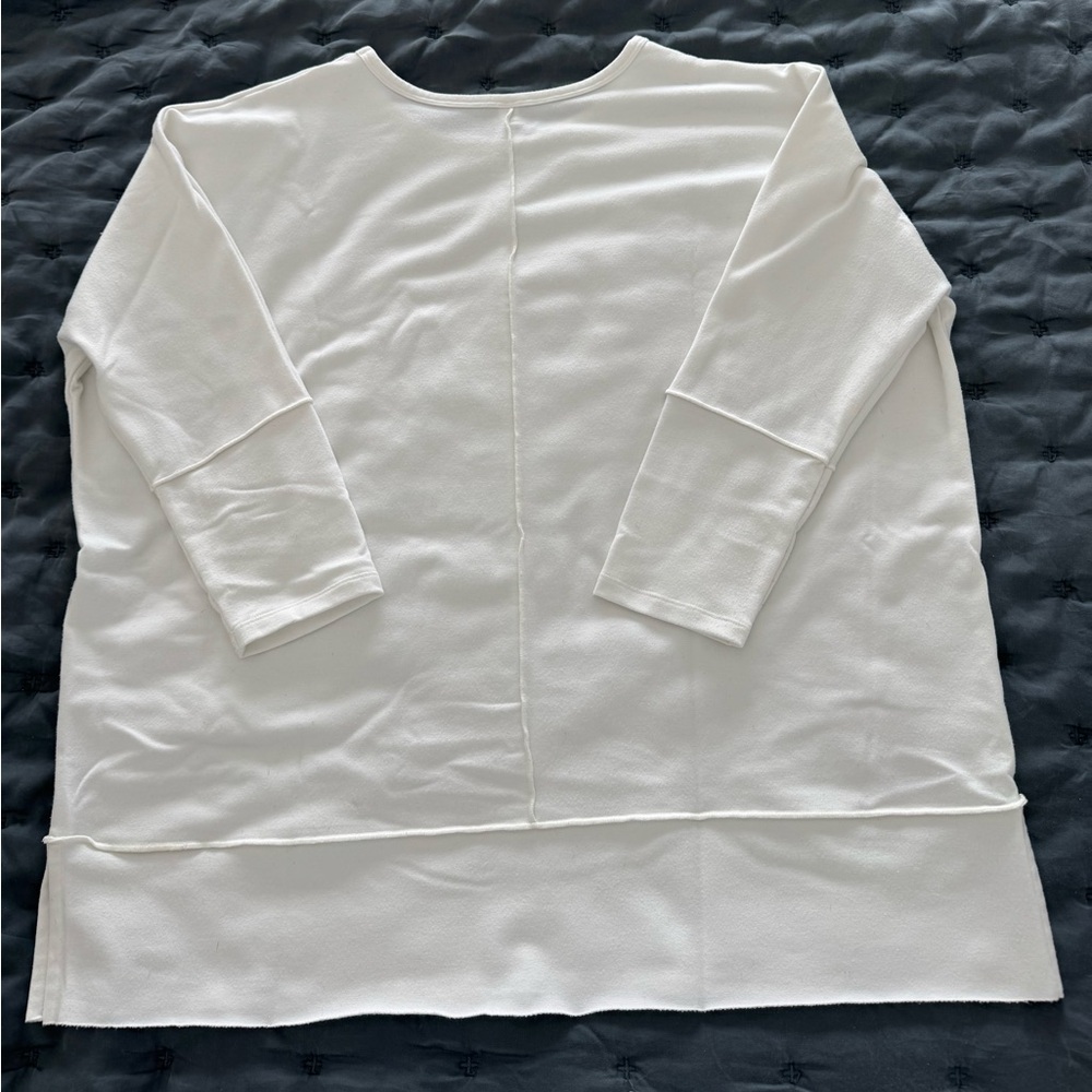 Super comfortable Spanx top. Oversized and the fabric has a lot of stretch.